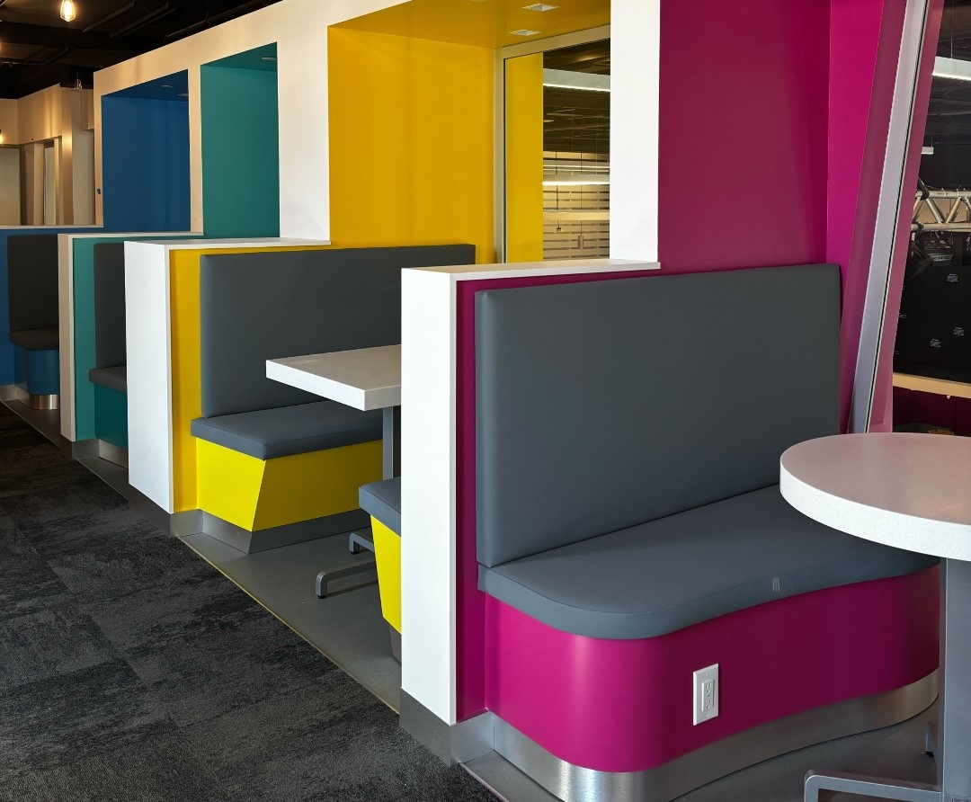 The booth sitting area on the second floor of marquee, designed for group study session. Each booth provides semi-private space for 2–4 people. 
      <br>Style: Modern design with colorful palette. The clean geometric shapes create visual appealing.<br>Material: Gloss painted seats and wall. Seats metal base trim, vinyl cushions. 
